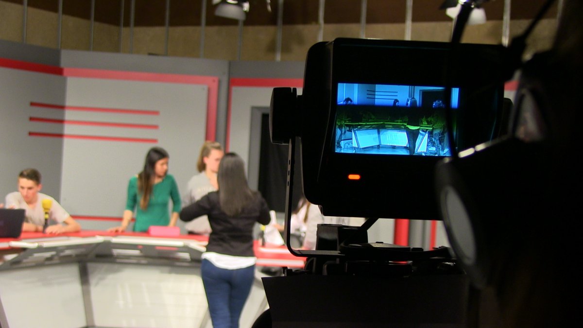 Students from Master's Degree in Communication and Education working on a TV Studio